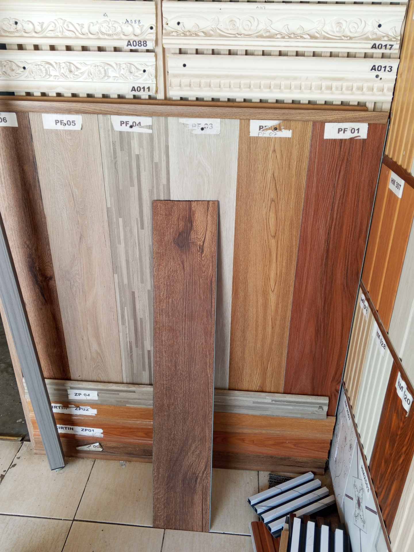 Showroom wall of SPC plank samples with product codes